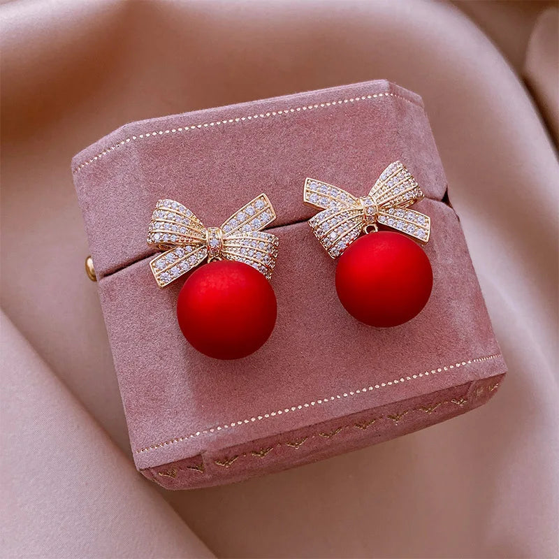 the BELLE OF THE BALL - Luxury Gold Color Zircon Bowknot Stud Earrings Red Pearl Flower Festive Earring New Year Christmas Jewelry Gifts