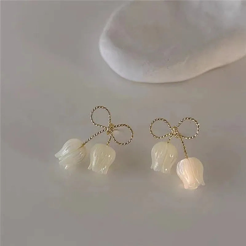 the WHITE TULIPS - Fashion Hollow Bowknot White Tulip Fritillary Stud Earring Christmas Gift